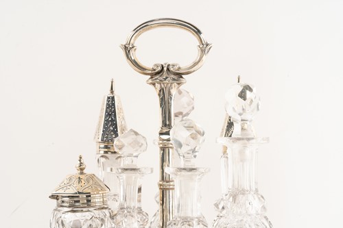 Lot 536 - A Victorian silver seven-bottle table cruet,...