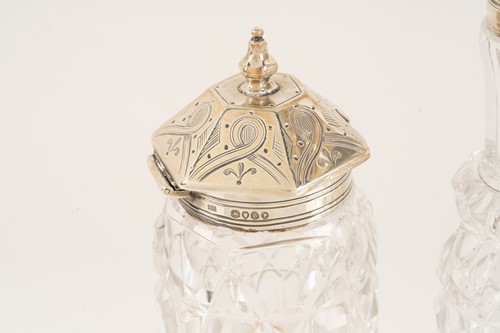 Lot 536 - A Victorian silver seven-bottle table cruet,...