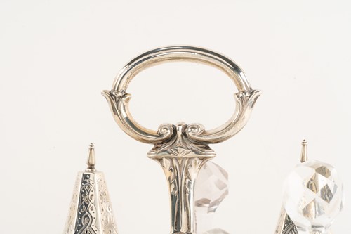 Lot 536 - A Victorian silver seven-bottle table cruet,...