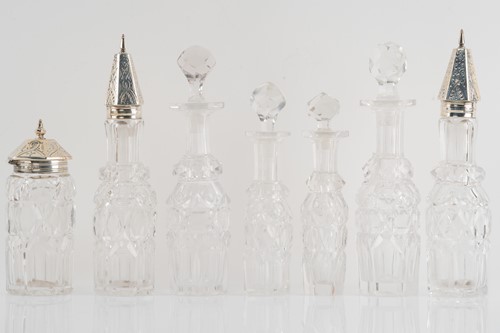 Lot 536 - A Victorian silver seven-bottle table cruet,...