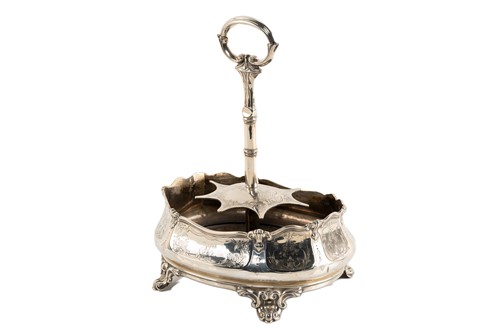 Lot 536 - A Victorian silver seven-bottle table cruet,...