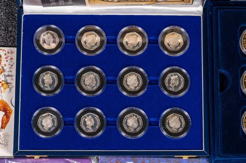 Lot 328 - Twelve silver proof 50p sets, set twelve...