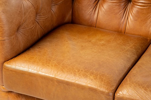Lot 144 - A traditional leather Chesterfield two settee,...