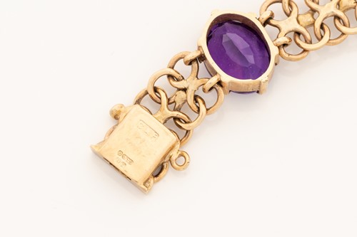 Lot 2 - A bracelet set with amethysts in 9ct gold,...