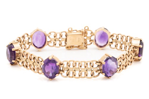 Lot 2 - A bracelet set with amethysts in 9ct gold,...