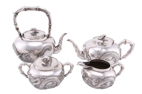 Lot 121 - A Chinese silver four piece tea set by Wang...