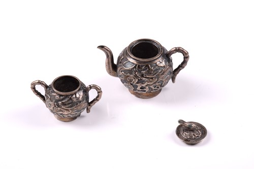 Lot 136 - A Chinese miniature silver teapot and sugar...