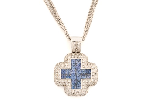 Lot 272 - A diamond and sapphire cruciform pendant; pavé...