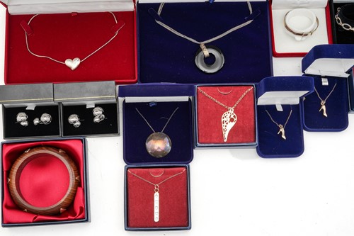 Lot 23 - A collection of silver jewellery; including...