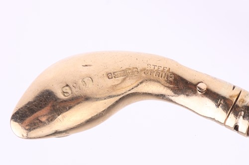 Lot 89 - A 9 carat gold coiled snake bracelet; the gold...