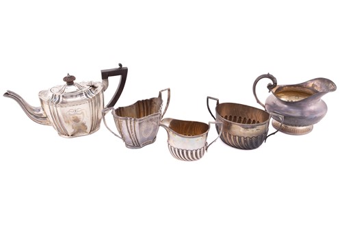 Lot 508 - An George III style silver teapot and scurier,...