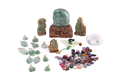 Lot 229 - A collection of jade items, including examples...