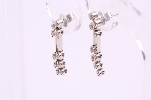 Lot 54 - A pair of diamond drop earrings in 18ct white...