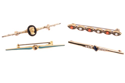 Lot 43 - Four gem-set bar brooches, including a coral...