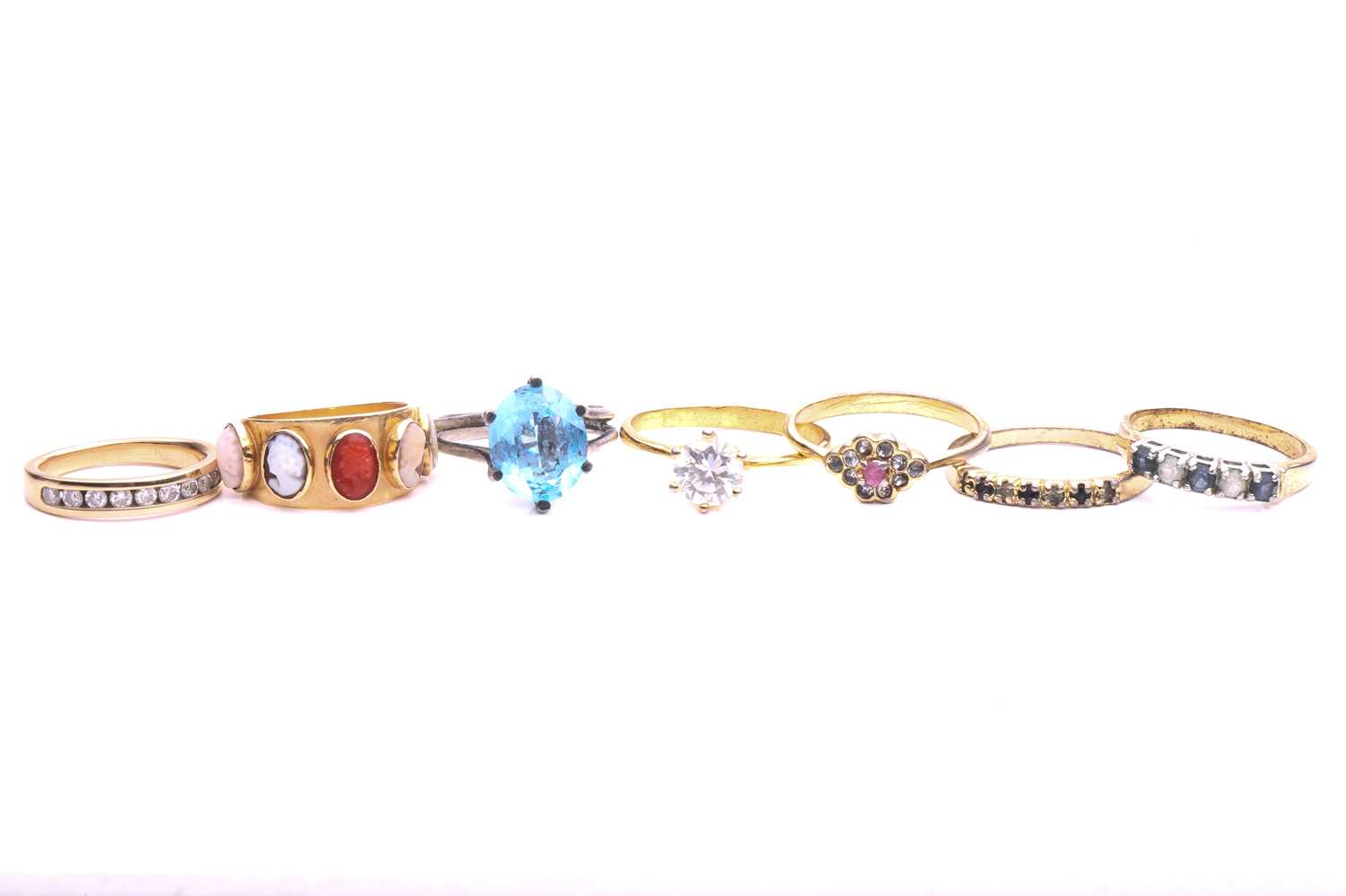 Lot 128 - A collection of seven gem-set rings; to...