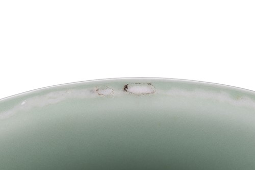 Lot 119 - A Chinese celadon ware wide-mouthed jar, with...