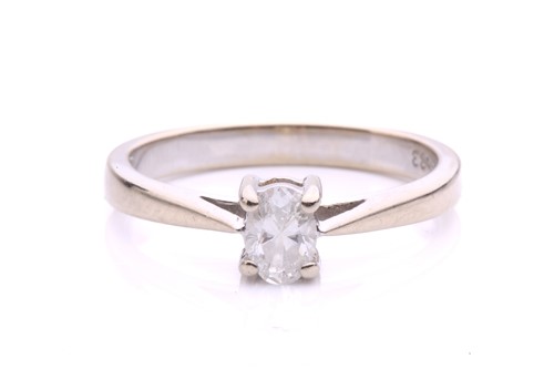 Lot 46 - A diamond solitaire ring in 18ct white gold,...