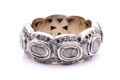 Lot 193 - A polki diamond eternity ring, comprising...