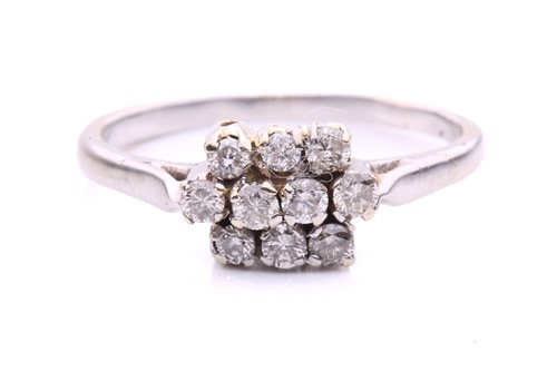 Lot 154 - A three-row diamond set ring, with 10 claw set...