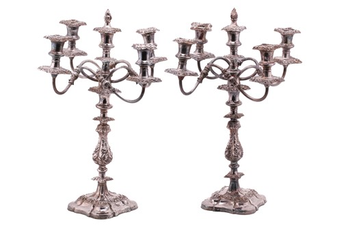 Lot 449 - A pair of silver plated candelabra each with a...