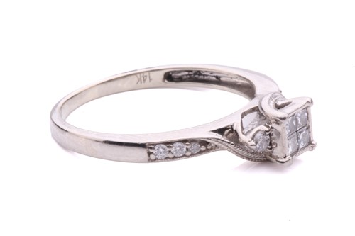 Lot 161 - A princess cut diamond set cluster ring with...