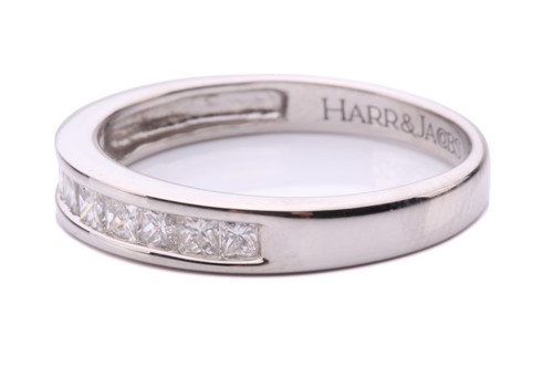 Lot 251 - A diamond half hoop eternity ring, channel set...