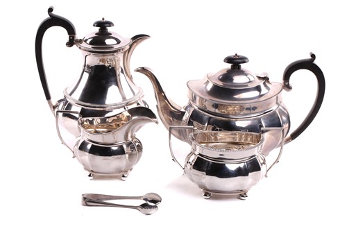 Lot 432 - A four-piece silver teaset, oval with ovolo...