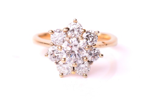 Lot 96 - A diamond cluster ring set in yellow metal,...