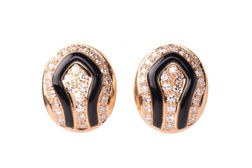 Lot 42 - A pair of diamond and onyx earclips, circa...