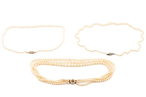 Lot 103 - Three cultured pearl necklaces, comprising two...