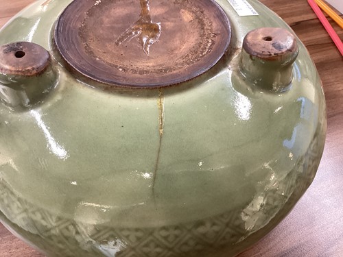 Lot 114 - A Chinese celadon circular censer with diaper...