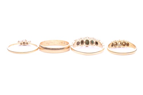 Lot 52 - A collection of four gem-set rings; including...