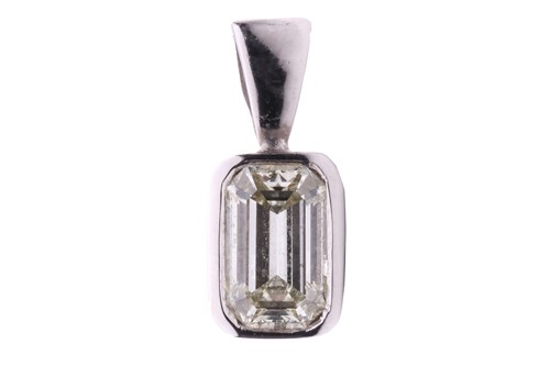 Lot 187 - An emerald-cut diamond pendant in 18ct white...