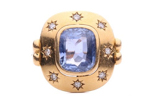 Lot 199 - A sapphire and diamond dress ring, centred...