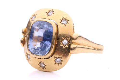 Lot 199 - A sapphire and diamond dress ring, centred...