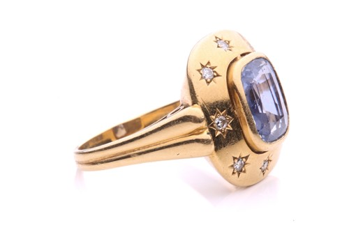 Lot 199 - A sapphire and diamond dress ring, centred...