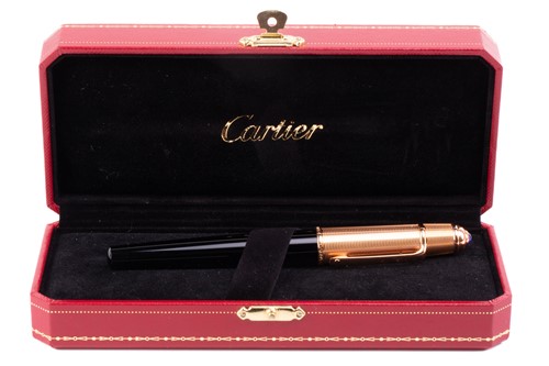 Lot 299 - Cartier - A black composite rollerball pen...