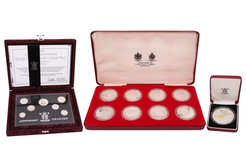 Lot 319 - A cased set of eight proof silver encapsulated...