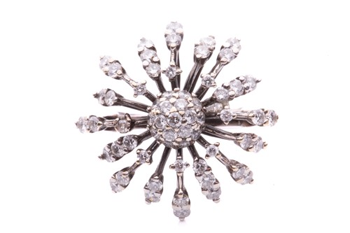 Lot 100 - A diamond-set starburst ring, centred with a...