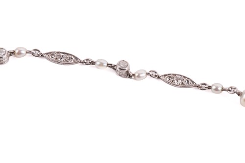 Lot 107 - An Art Deco chain necklace set with pearls and...