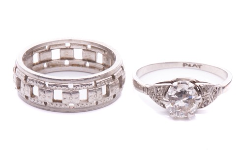 Lot 197 - A diamond solitaire ring and another; the...