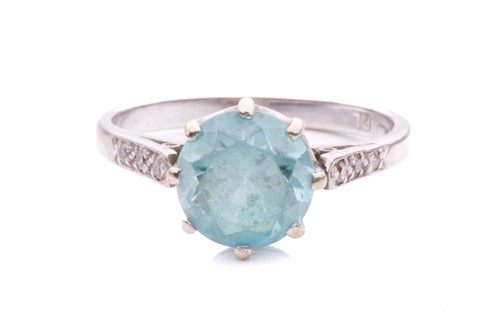 Lot 18 - A blue zircon and diamond dress ring, centred...