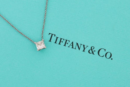 Lot 10 - Tiffany & Co. - a princess-cut solitaire...