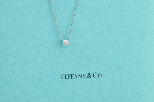 Lot 10 - Tiffany & Co. - a princess-cut solitaire...