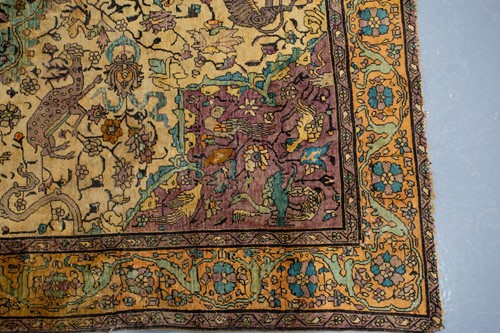 Lot 365 - An antique Kashan silk on-silk rug with a...