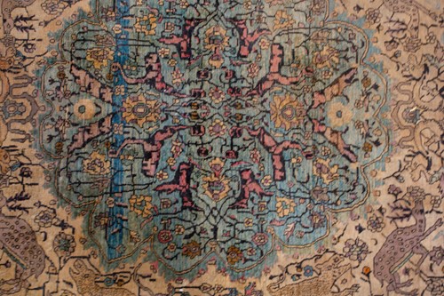 Lot 365 - An antique Kashan silk on-silk rug with a...
