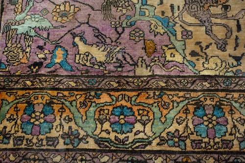 Lot 365 - An antique Kashan silk on-silk rug with a...