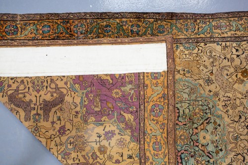 Lot 365 - An antique Kashan silk on-silk rug with a...
