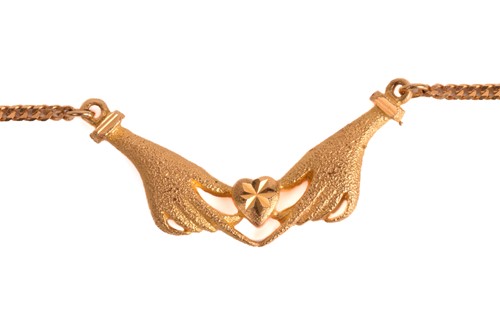 Lot 160 - A necklace depicting two hands clasping a...