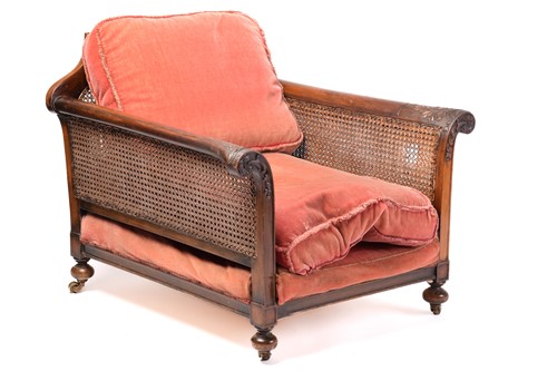 Lot 217 - A carved walnut three-seat Bergere sofa and...